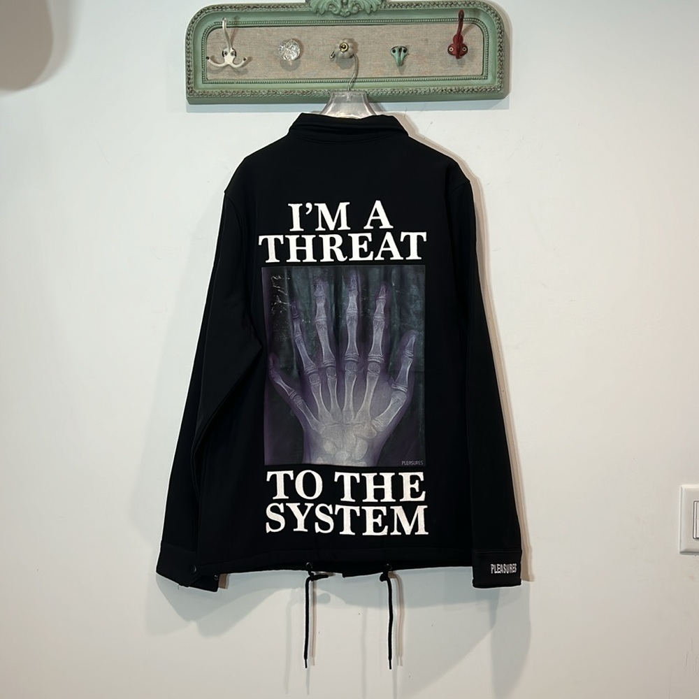 PLEASURES IM A THREAT TO THE SYSTEM X-RAY COACHES JACKET SIZE LARGE NWOT BLACK